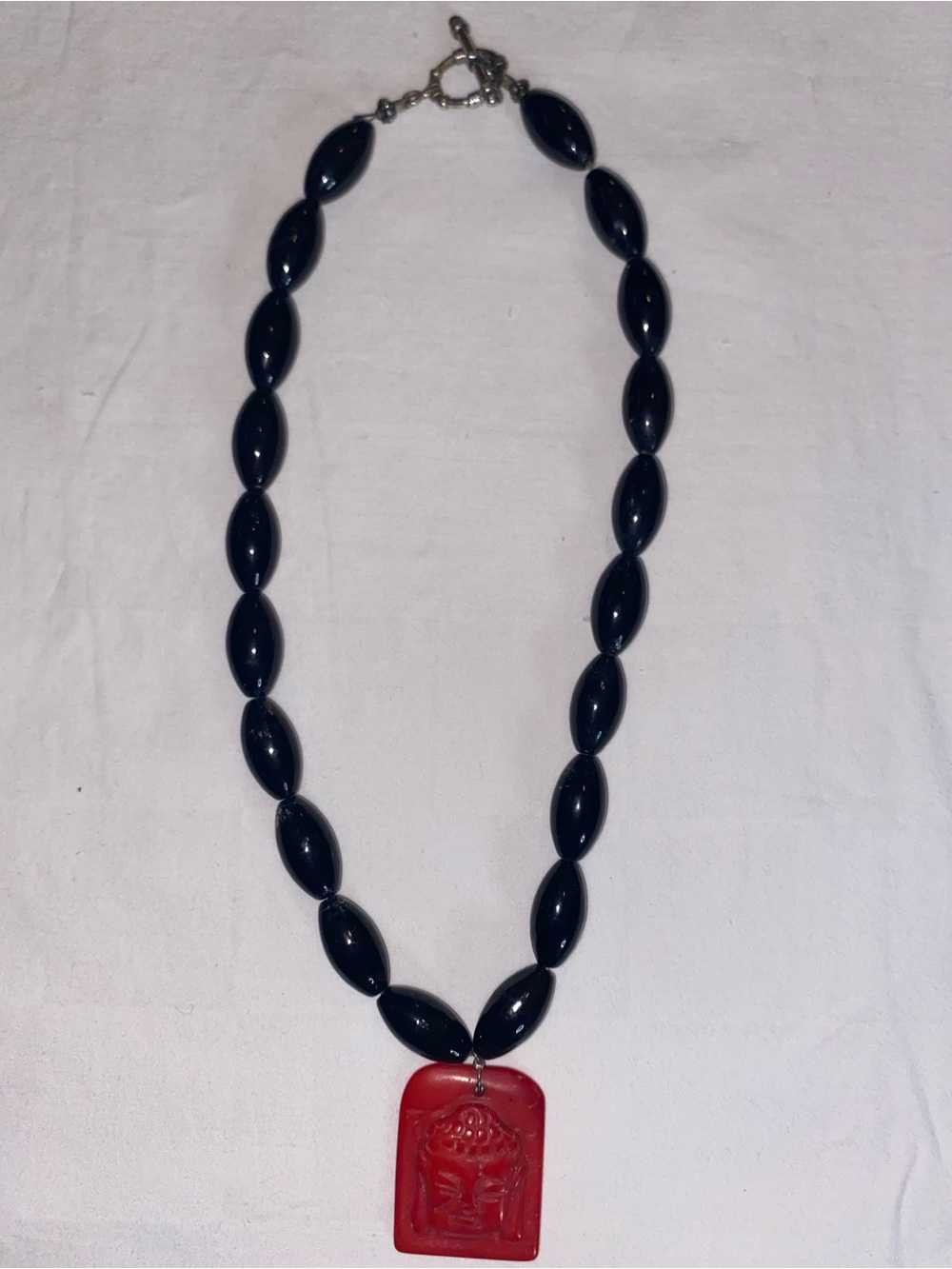 Black Beaded Necklace with Red Buddha Pendant